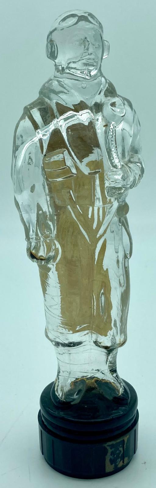 Glass figurine of pilot - view from one side