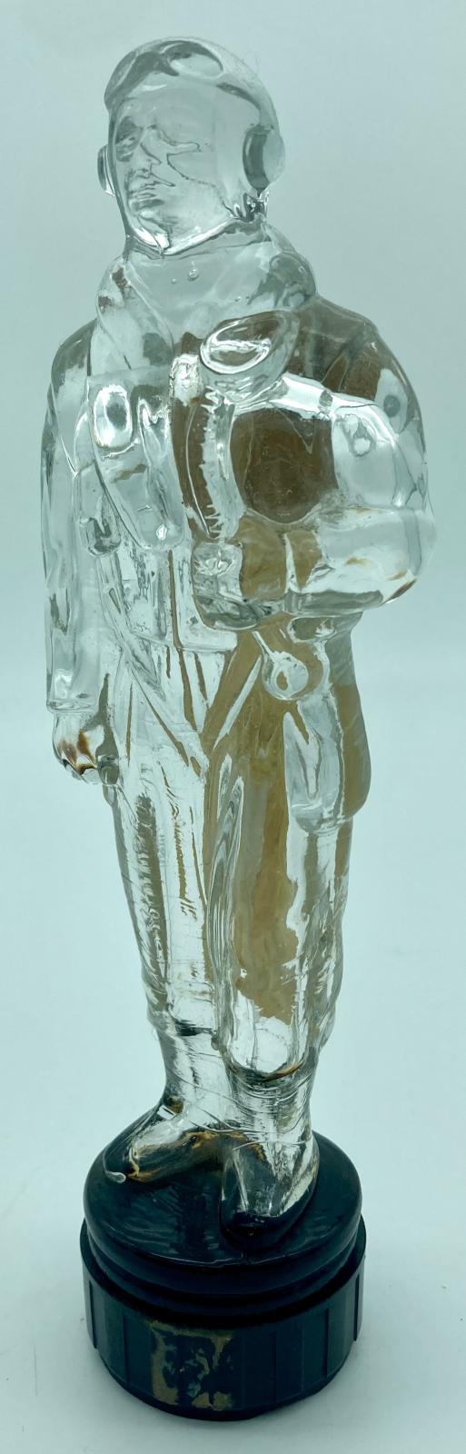 Glass figurine of pilot - view from one side