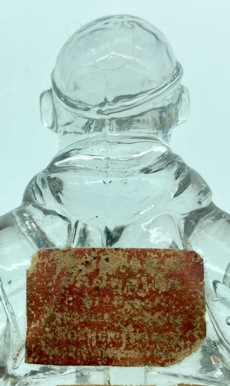 Maker's label on reverse of figurine