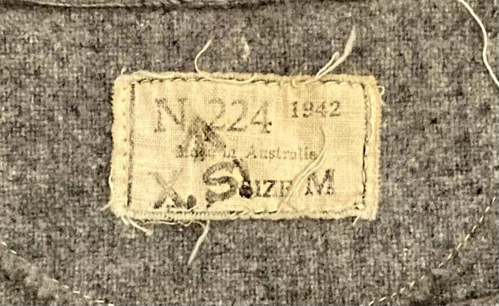 CGEF worker's woollen shirt - close up of clothing label