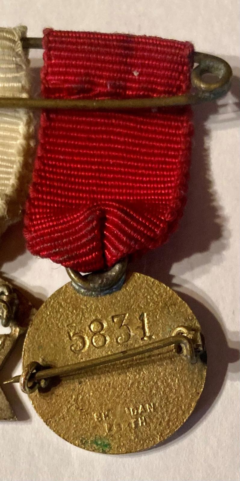 Australian Red Cross Society medal reverse showing maker's mark and number of issue