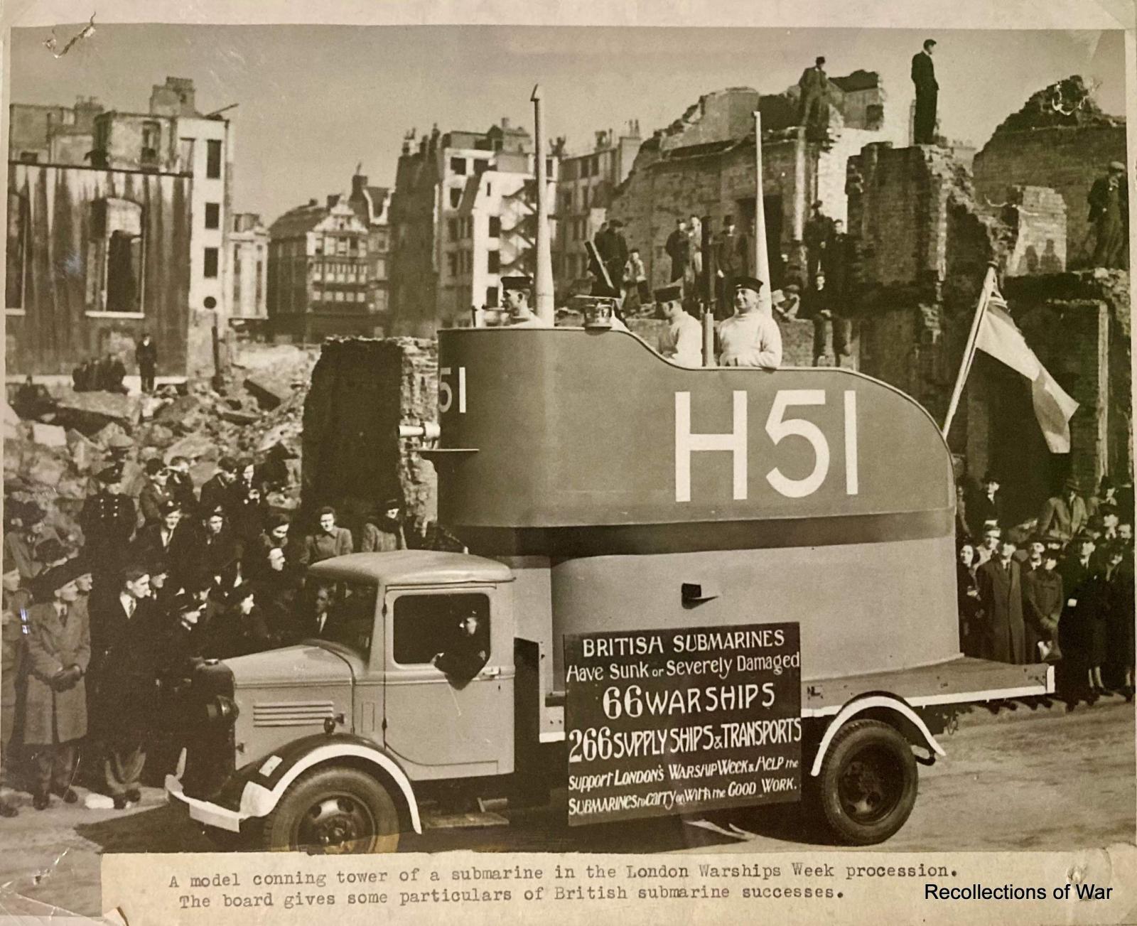 Photo showing a lorry carrying a replica submarine conning tower in London Warship Week parade