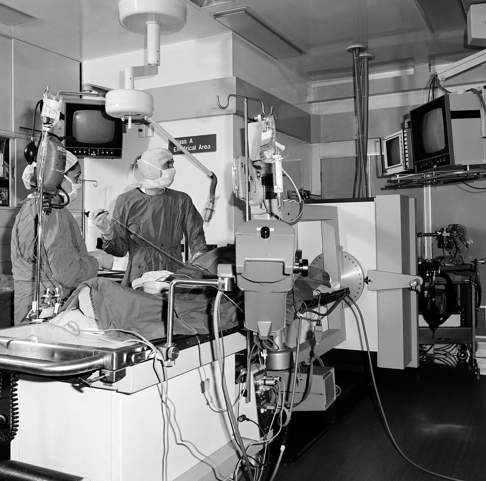 A RPH cardiologist inserts a catheter during a coronary angiography aided by closed-circuit x-ray 1983