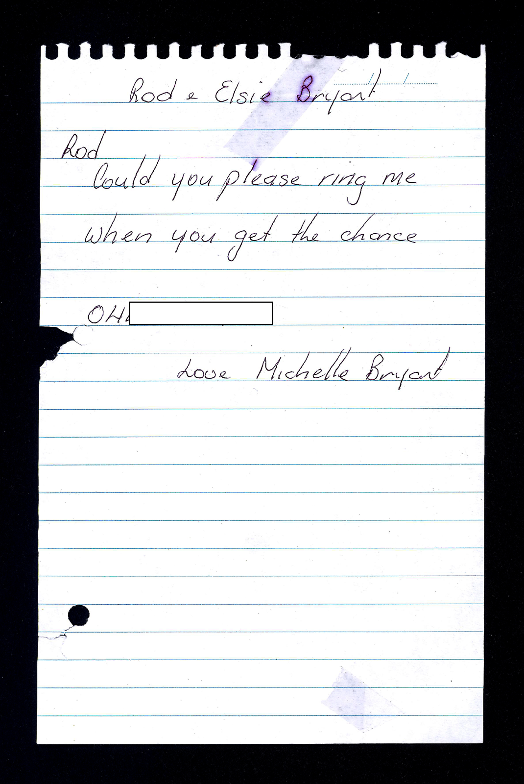 White blue lines note paper with six lines of handwritten text in black pen