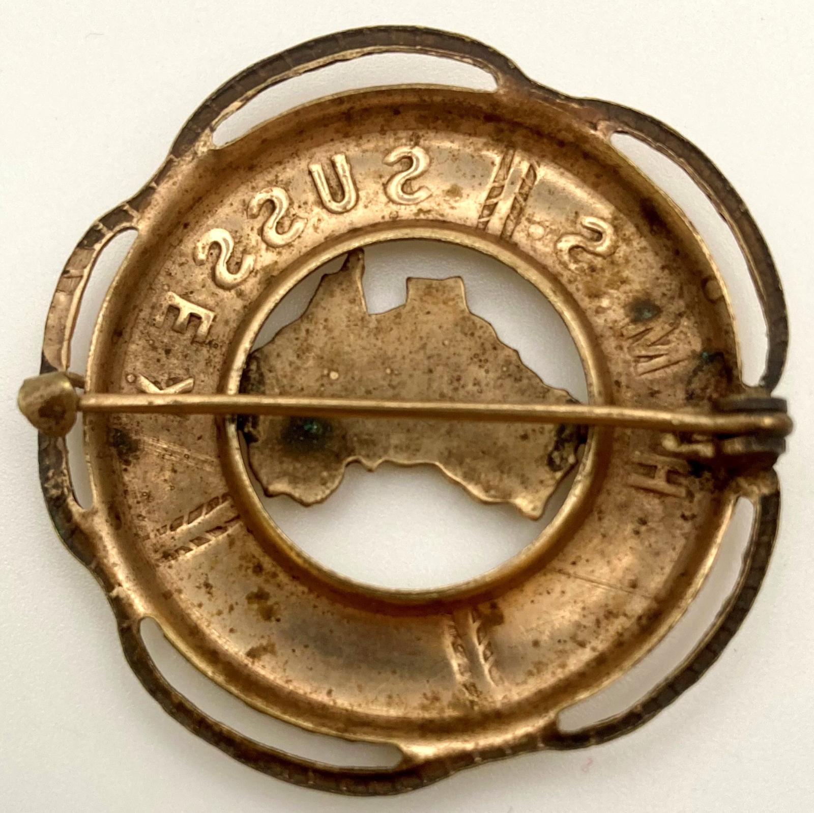 Reverse of 'H.M.S. Sussex' souvenir badge