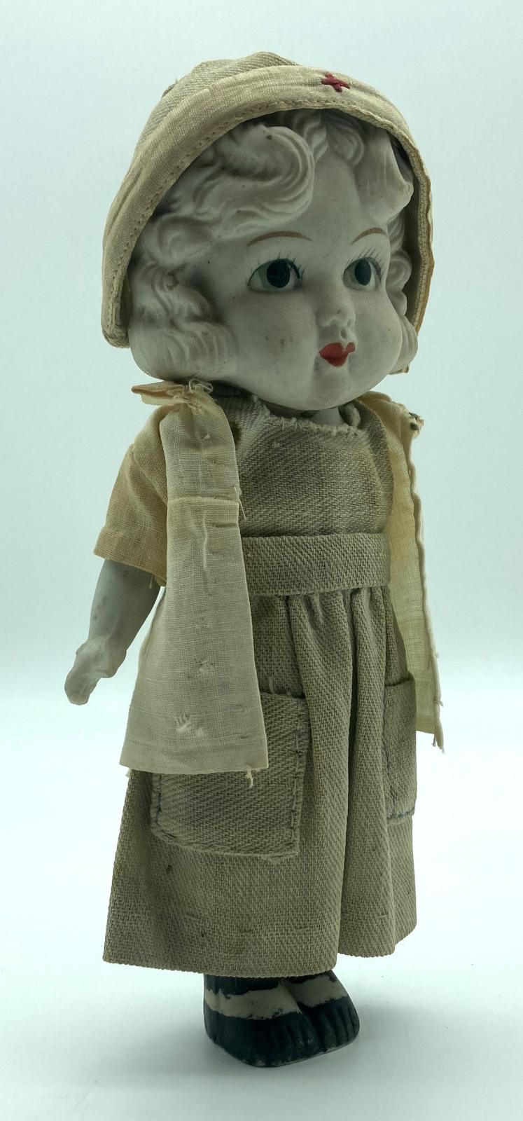 Antique bisque Red Cross doll - side view