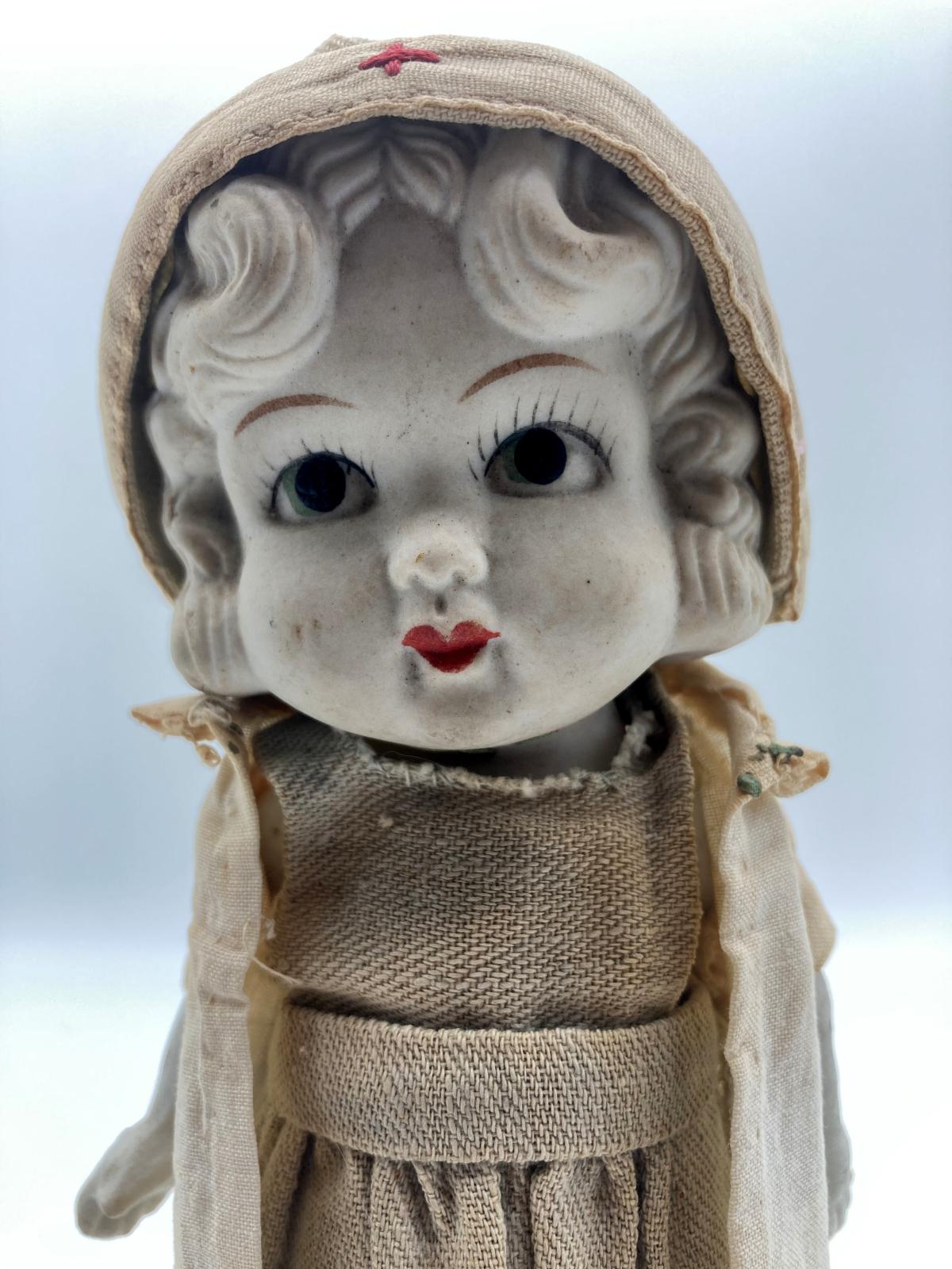 Antique bisque Red Cross doll - close-up