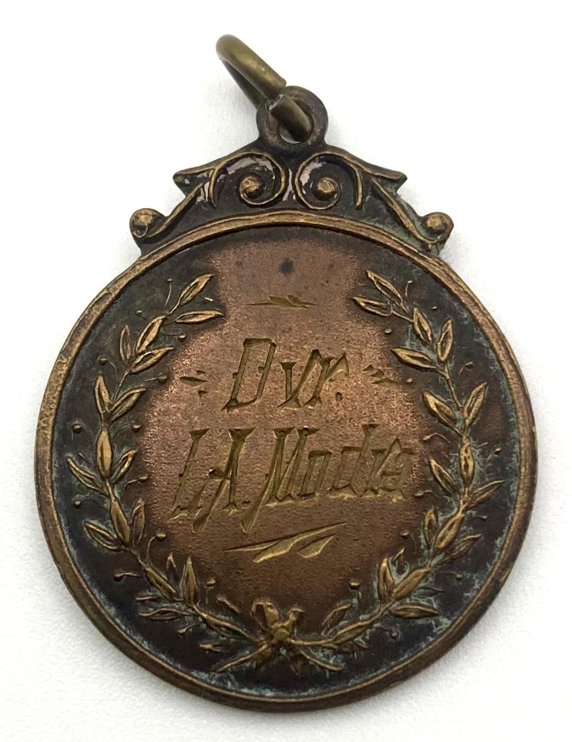 Medallion issued to Driver L.A. Modra showing inscription