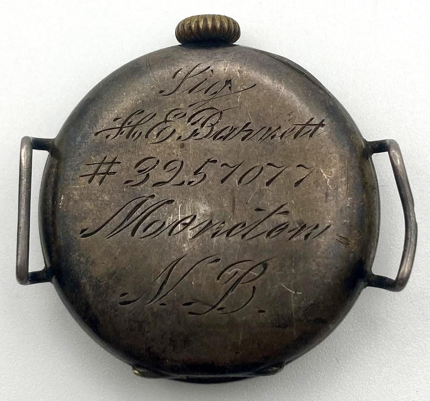 Reverse of WWI trench watch showing inscription