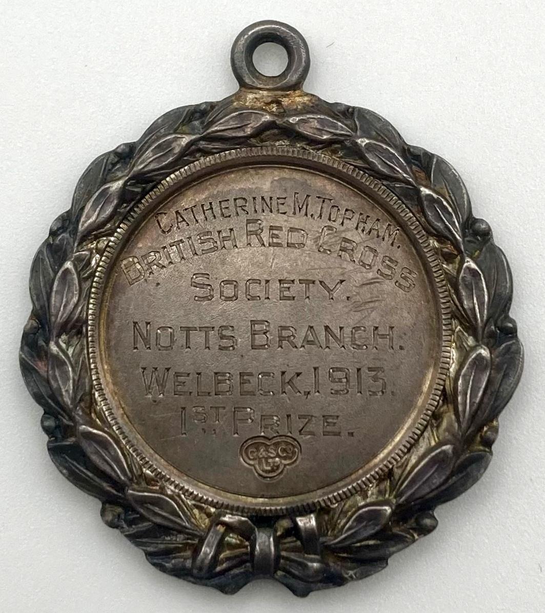 Reverse of B.R.C.S. medallion - Catherine M. Topham, 1913