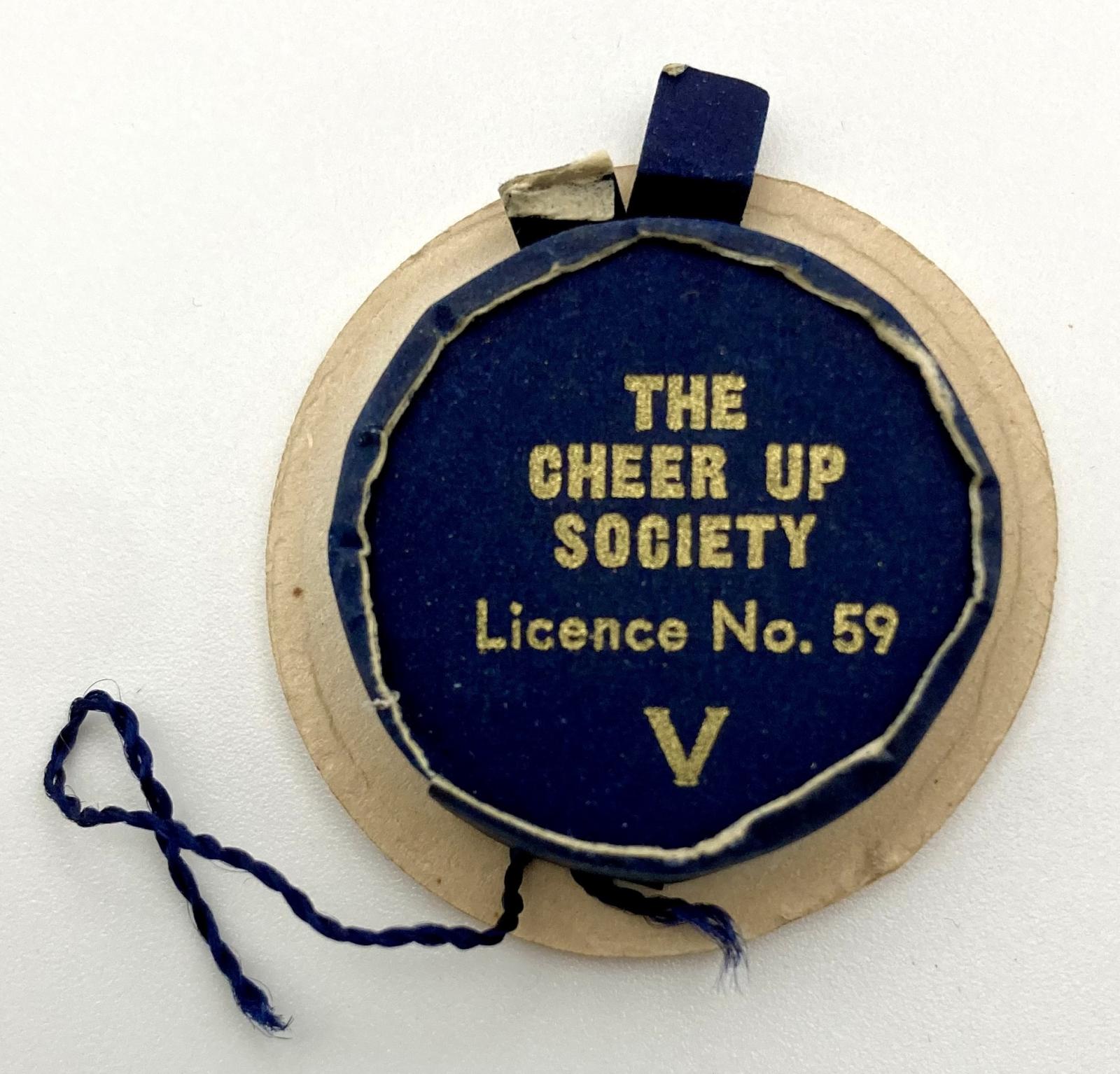 Underside of Cheer-Up Society fundraising pin in shape of a naval cap