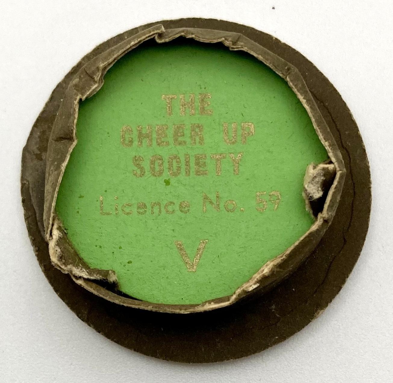 Underside of Cheer-Up Society fundraising pin in shape of Army peaked cap