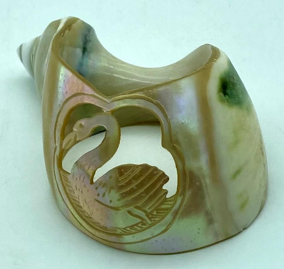 Carved shell napkin ring showing swan