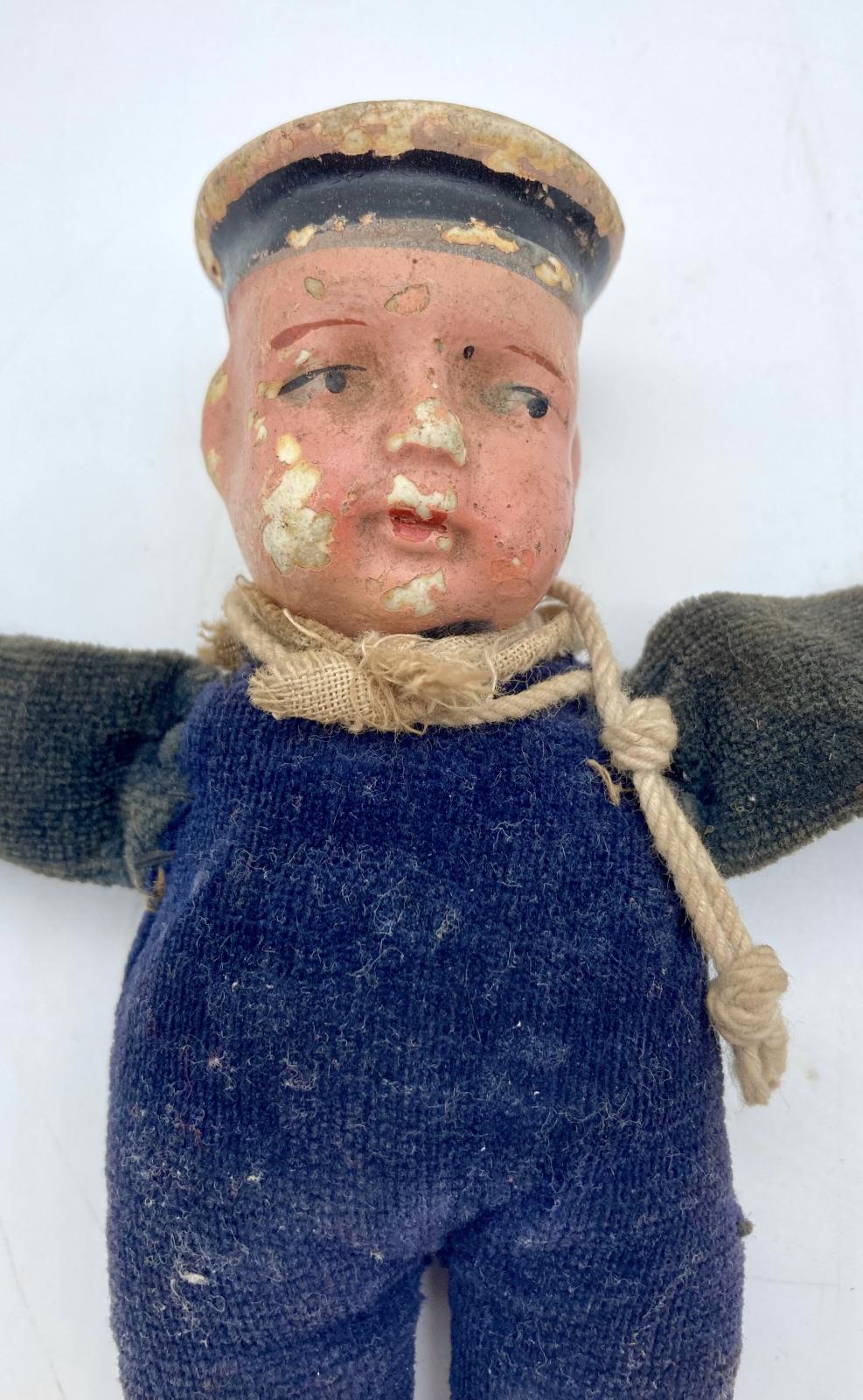 Close-up of WWI era sailor doll