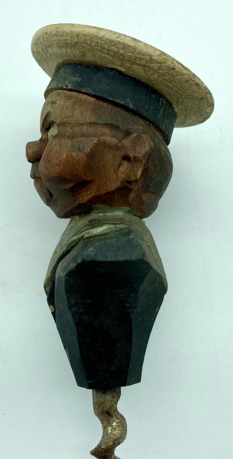 Other side view of carved sailor barware item - corkscrew