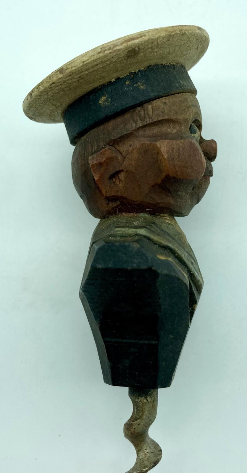 Side view of carved sailor barware item - corkscrew