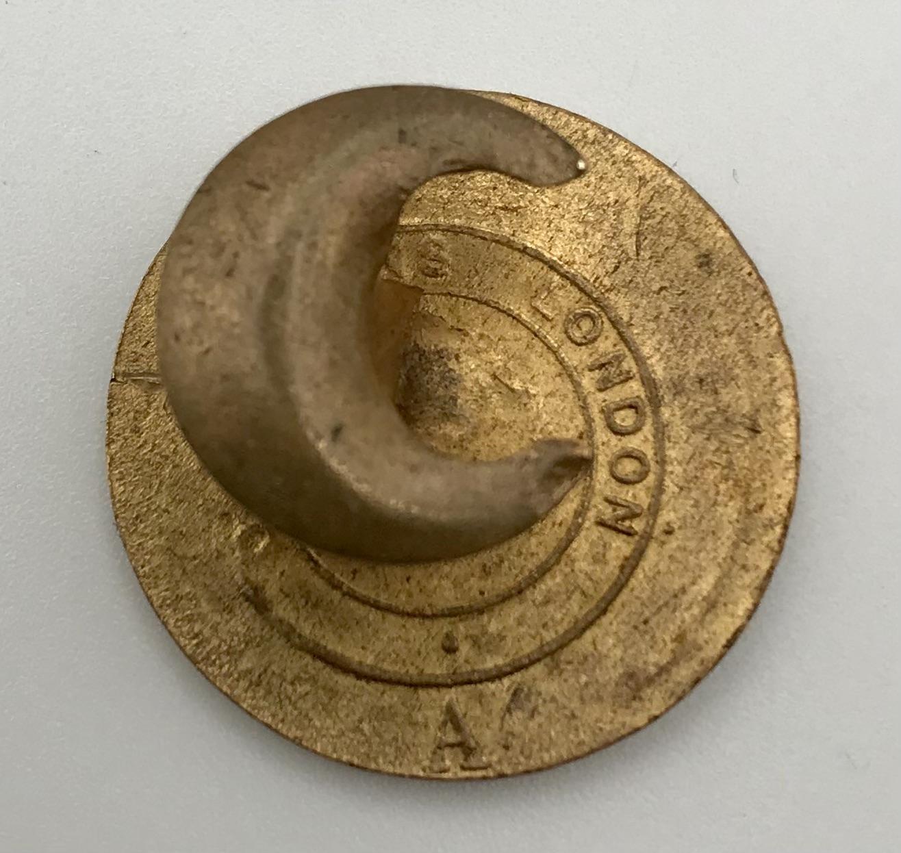 Reverse of 'On War Service 1914' Munition Workers badge