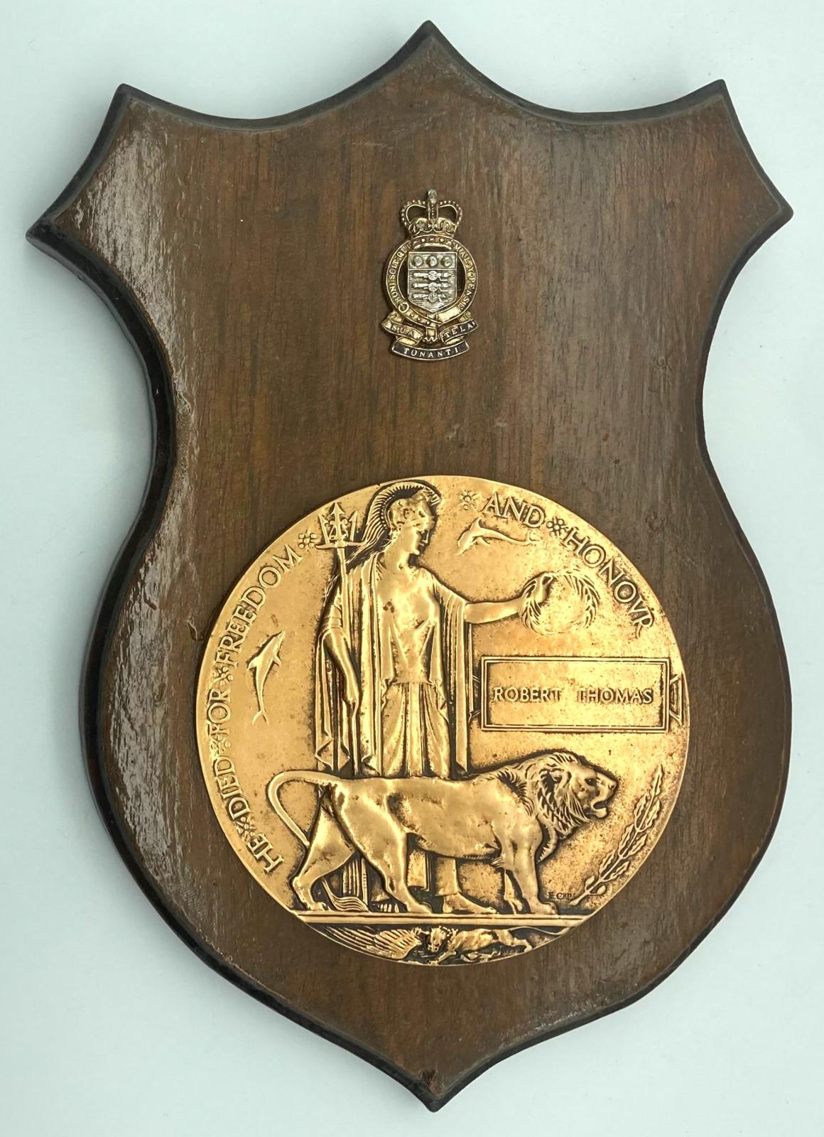 Robert Thomas Memorial Plaque mounted on timber shield