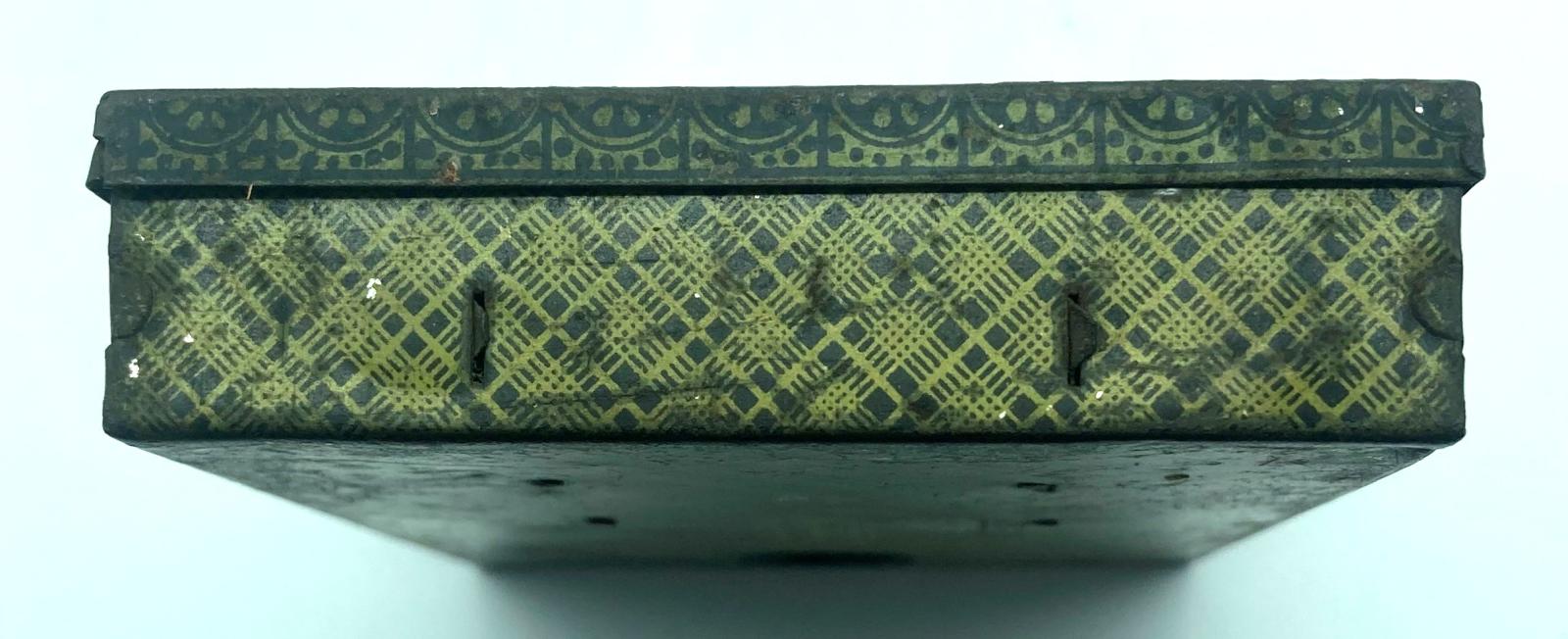 Pocket candlestick - edge of box showing decorative patterns