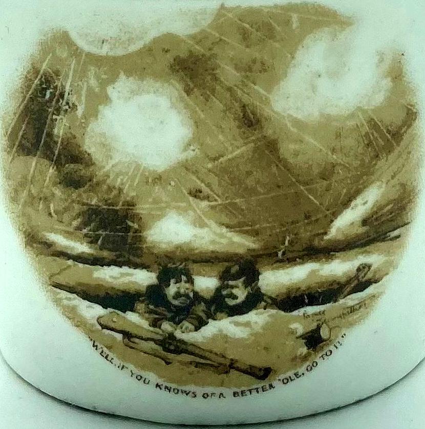 Close-up of WWI era china cup featuring Bruce Bairnsfather cartoon