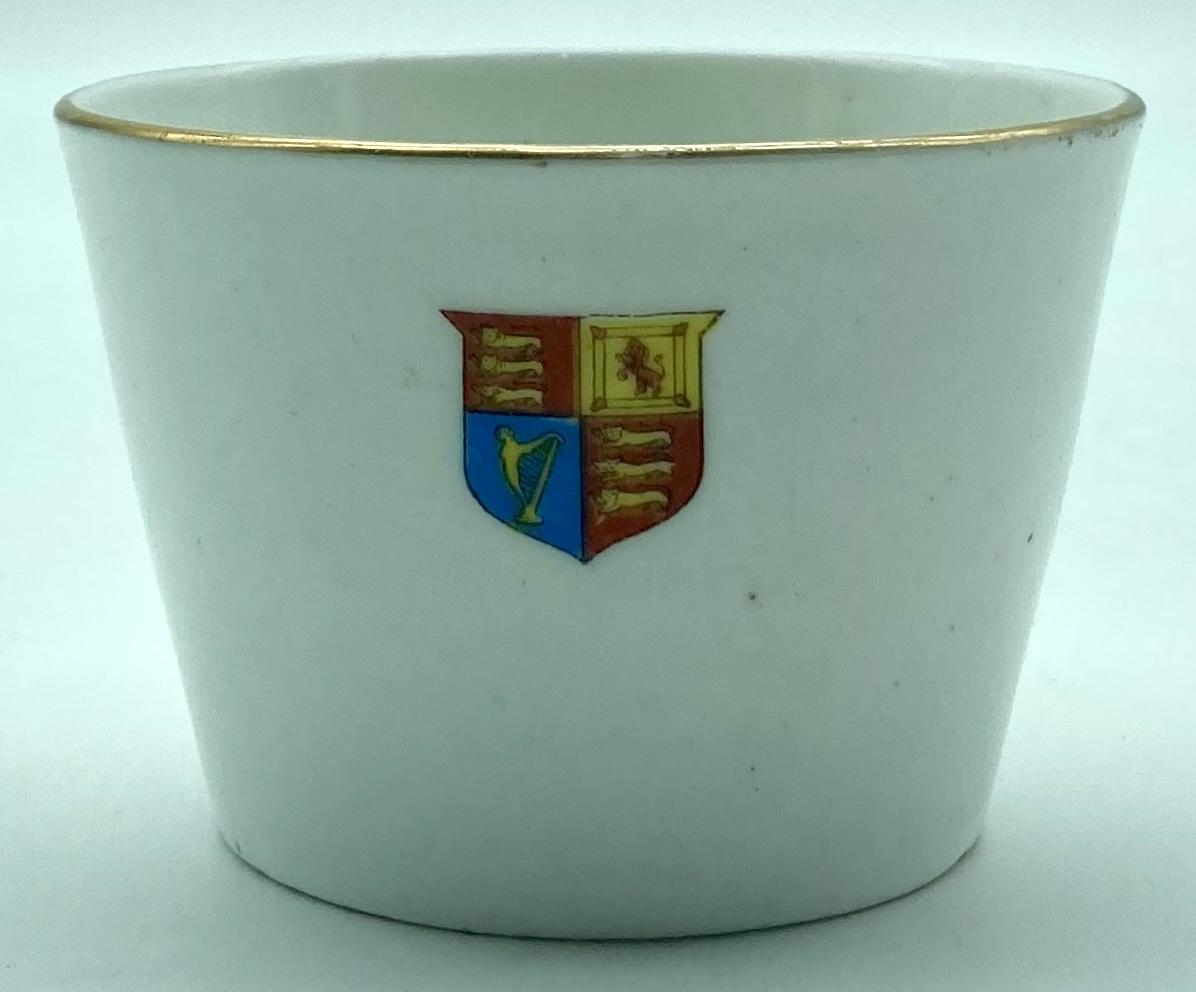 Reverse of WWI era china cup featuring Bruce Bairnsfather cartoon