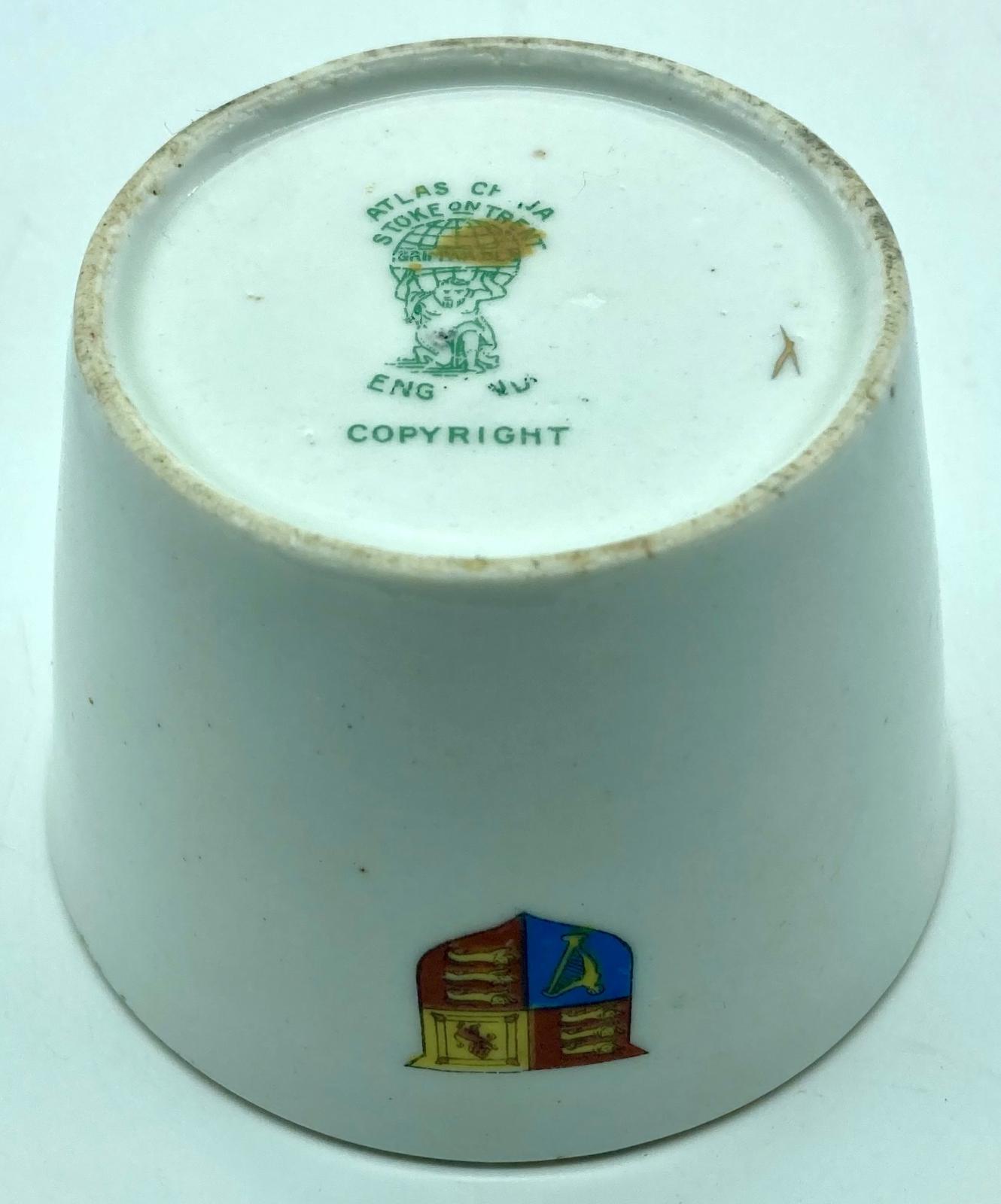 Base of WWI era china cup featuring Bruce Bairnsfather cartoon