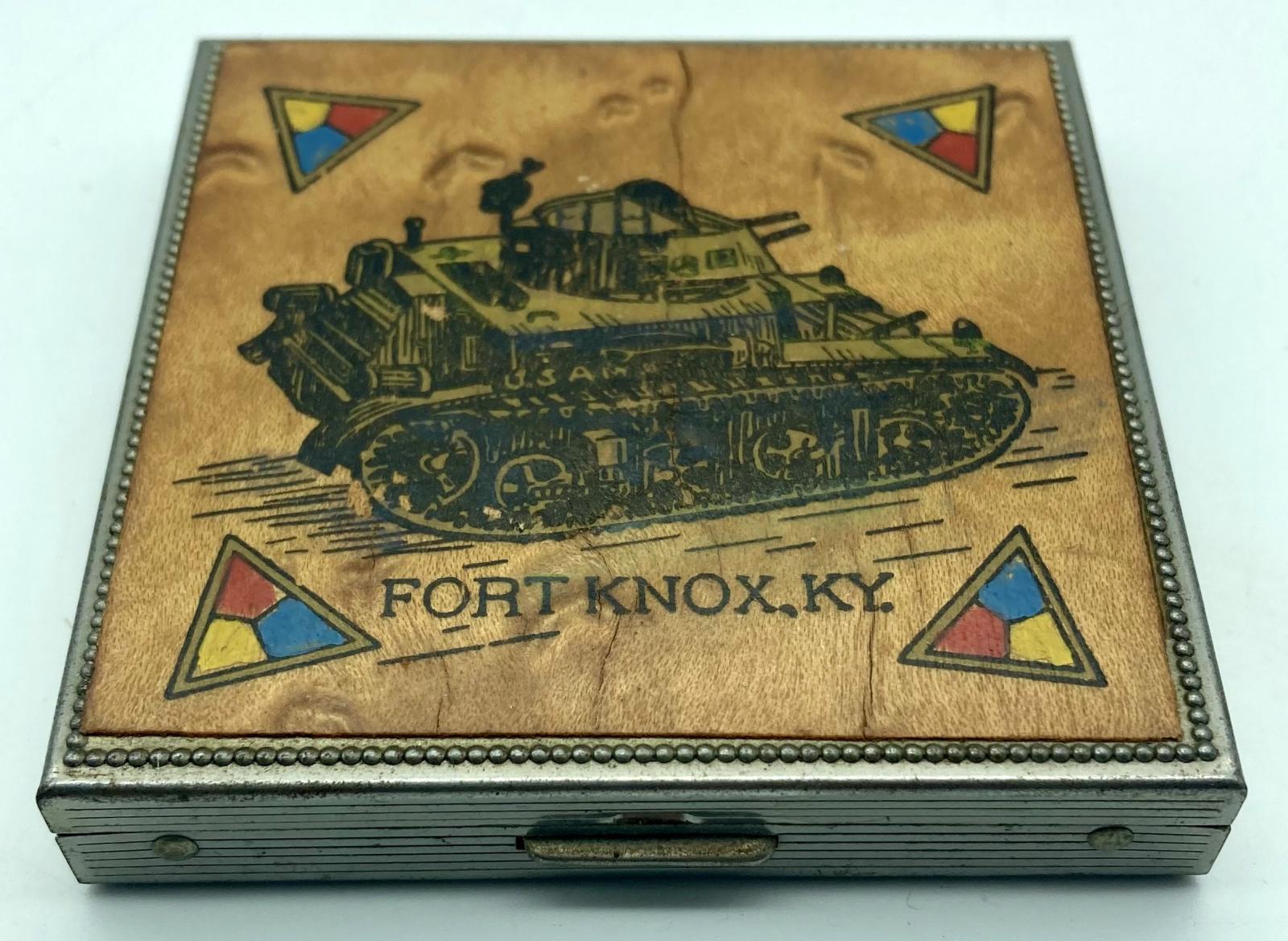 Timber and metal powder compact with tank and Fort Knox showing catch