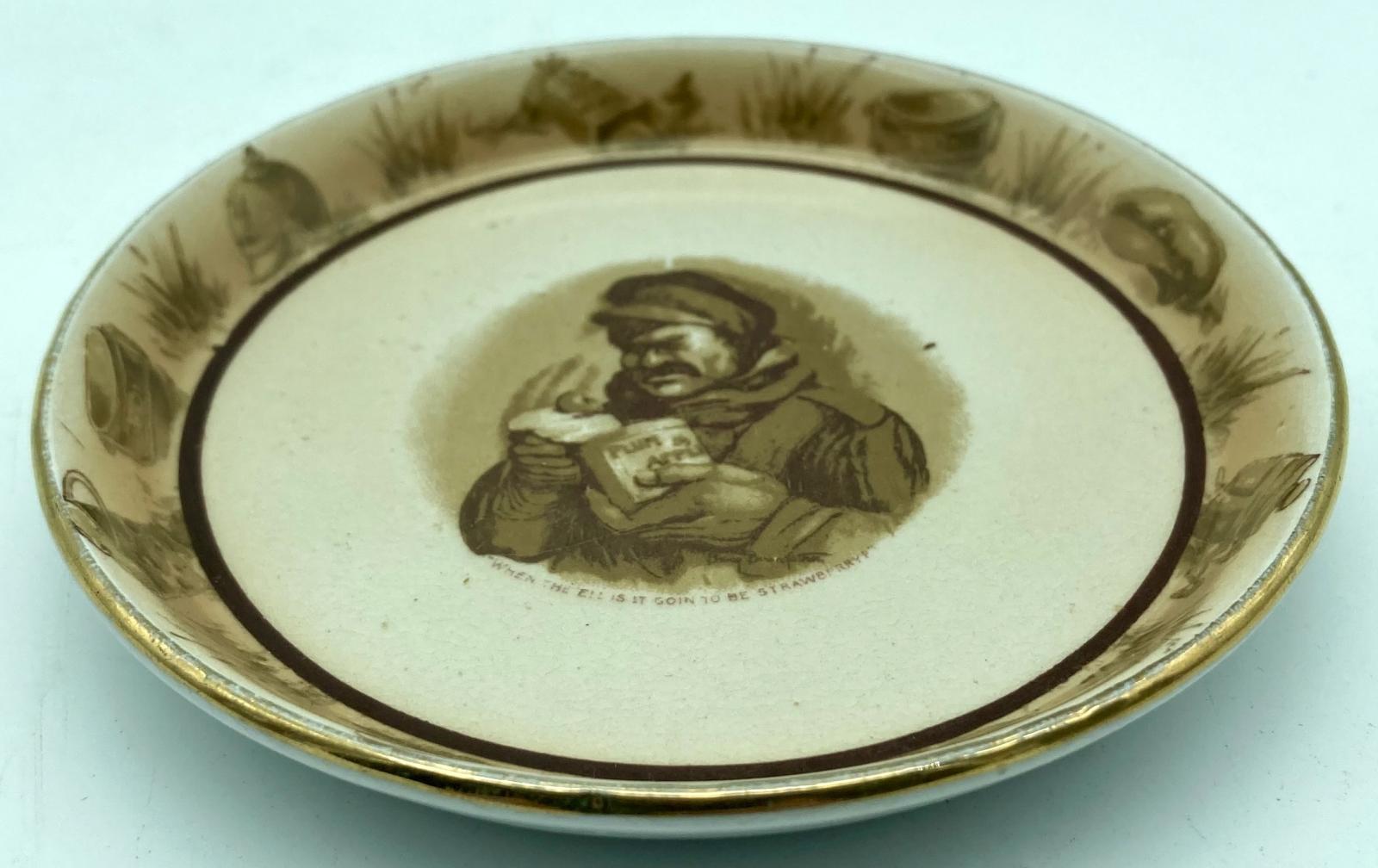 Oblique view of WWI era china dish featuring Bruce Bairnsfather cartoon