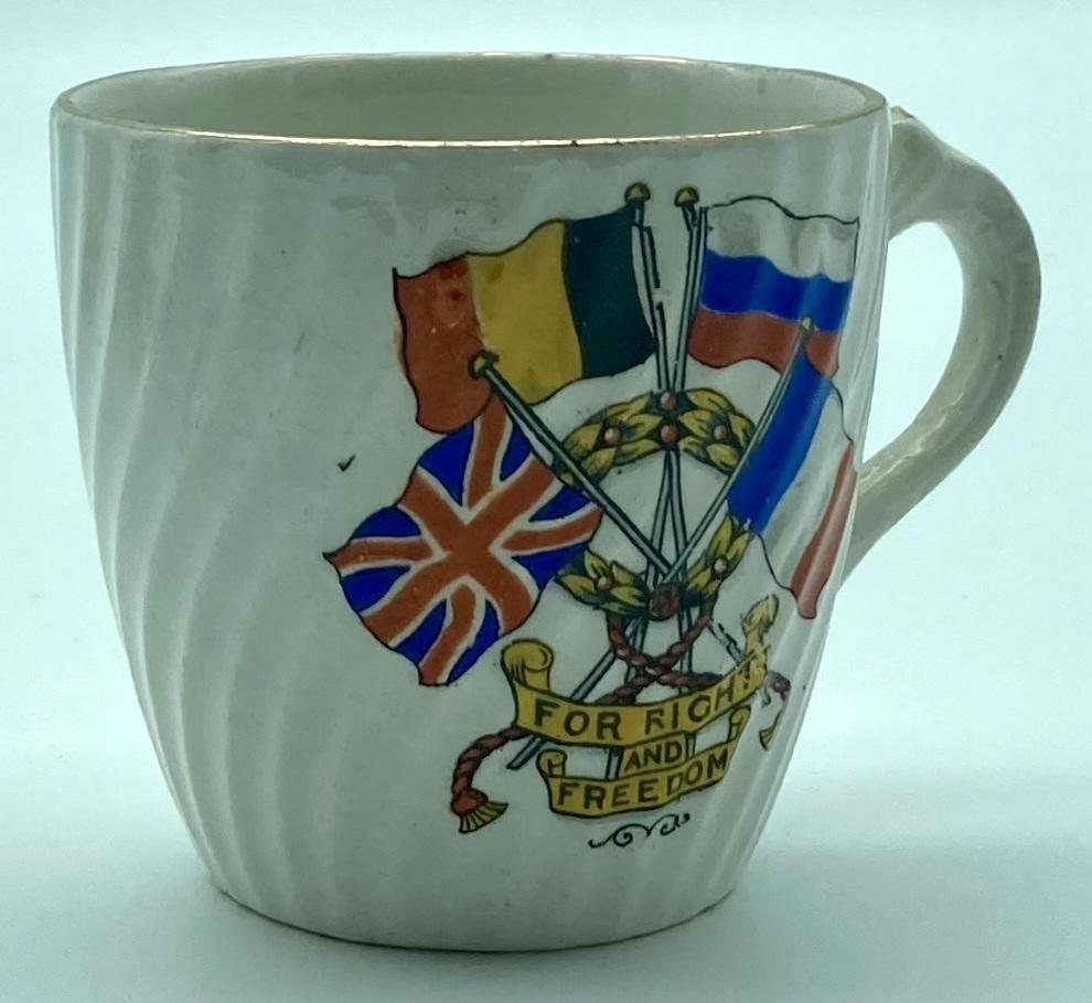 Side view of WWI era patriotic bone china cup 