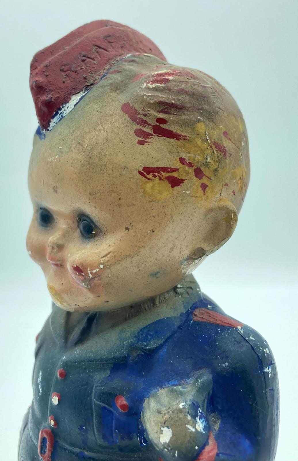 Close-up of painted chalkware figurine of R.A.A.F. airman Arthur Hammond