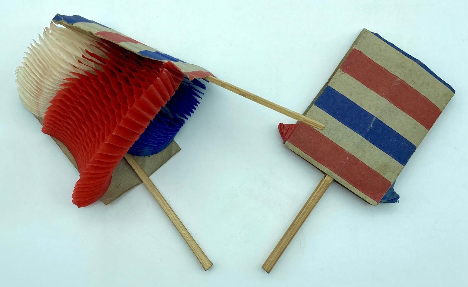 WWI era patriotic fold-out honeycomb balls, showing one closing and the other fully closed