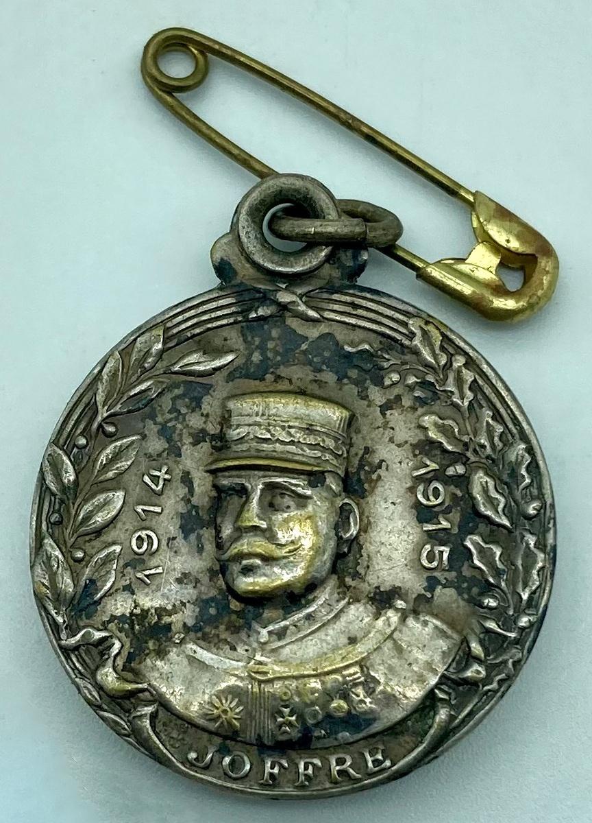 WWI era metal locket featuring the image of French General Joseph Joffre