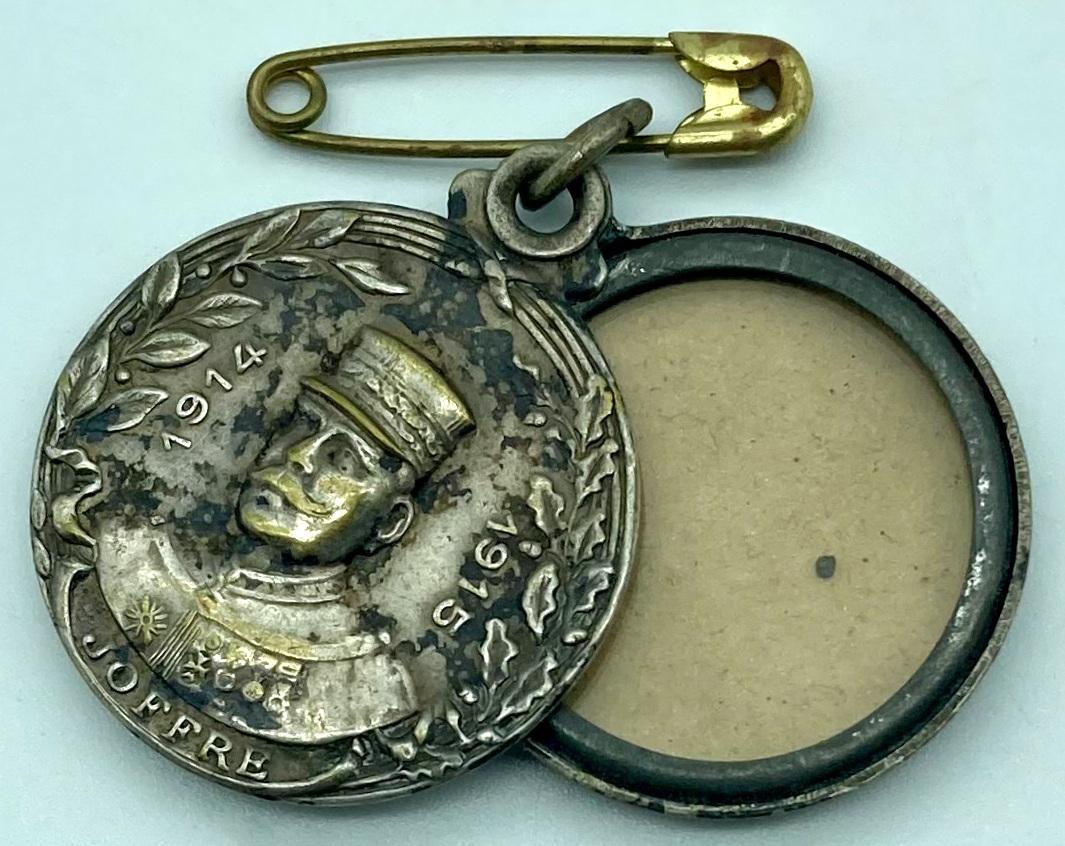 WWI era metal locket with French General Joseph Joffre - open showing place for photograph