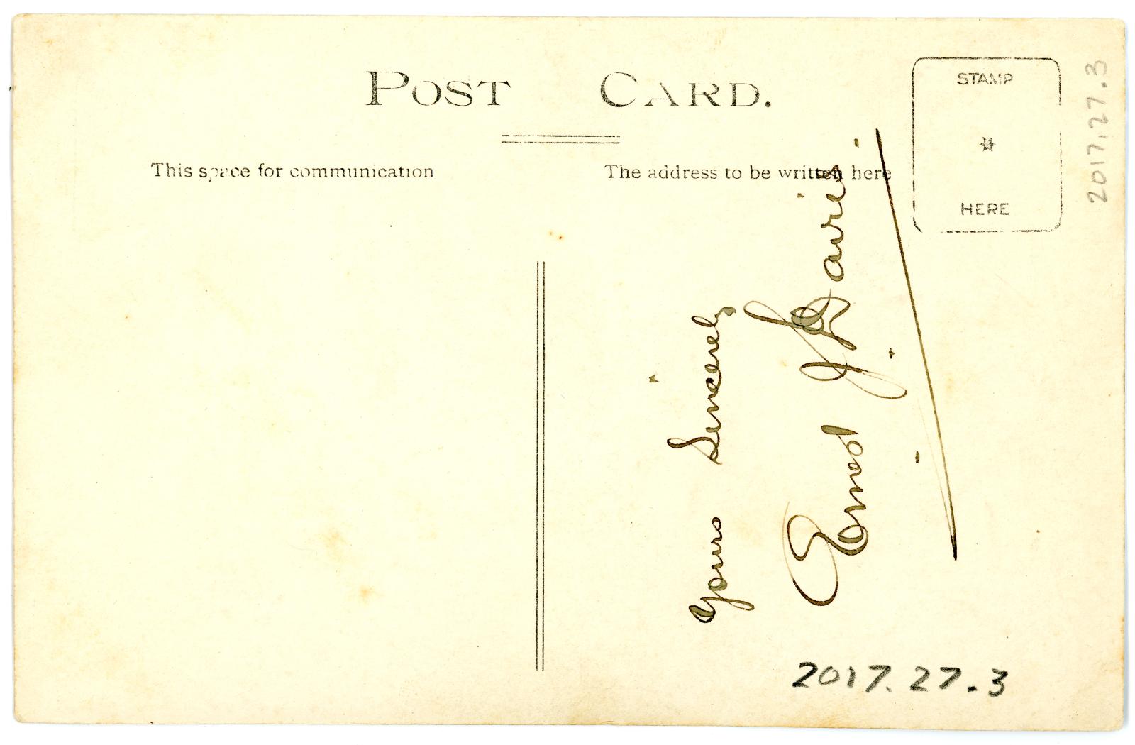 Black and white photographic postcard of Ernest James DAVIES in civilian clothing - back