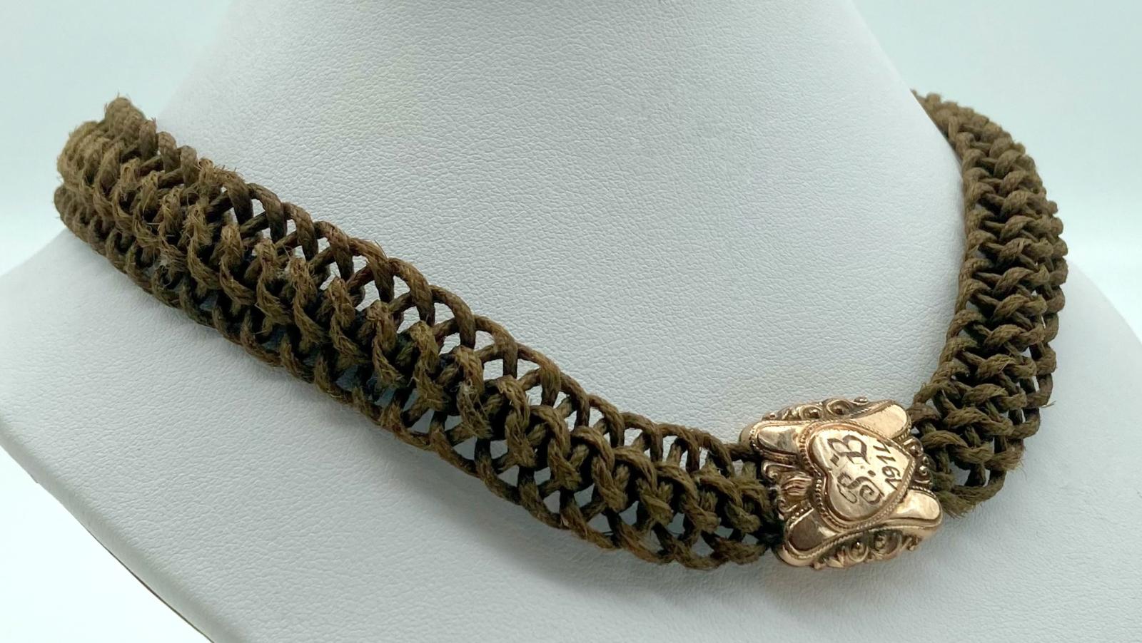 Close-up of mourning Albert chain made from woven human hair