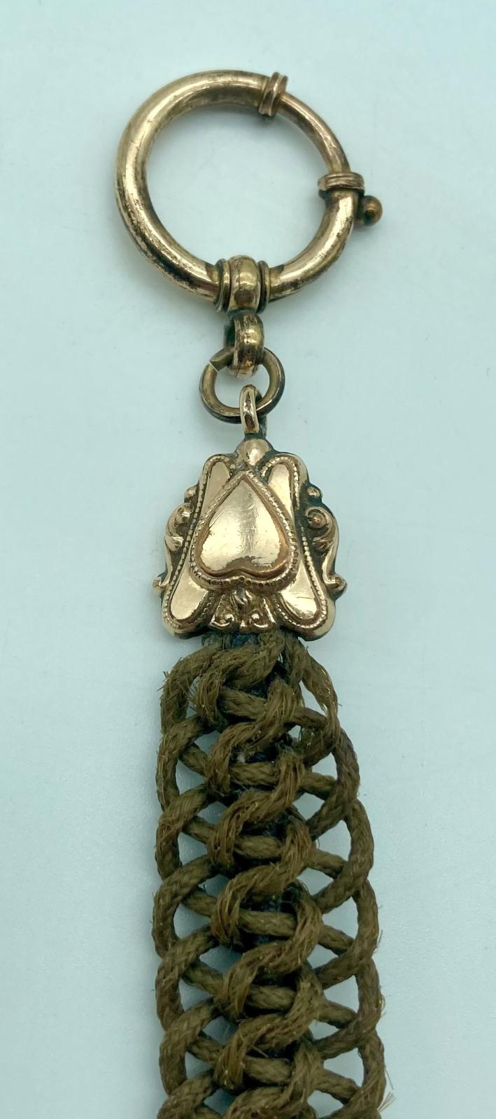 Top attachment of mourning Albert chain made from woven human hair