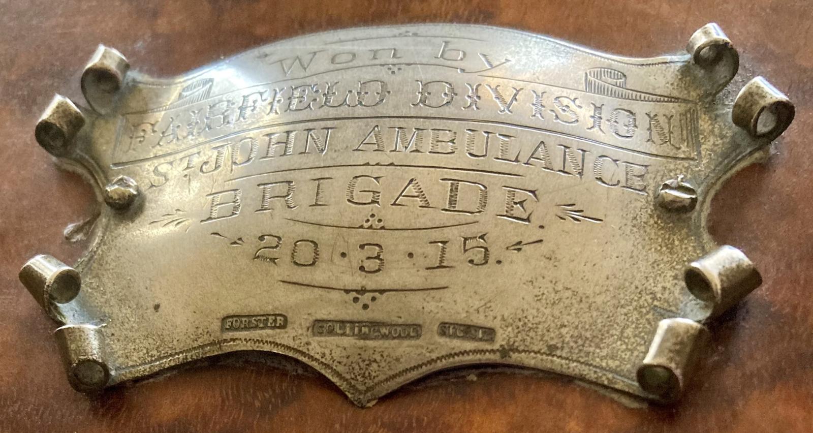 Engraved inscription to winner of St. John Ambulance Brigade Geelong 'Ambulance Competitions' shield