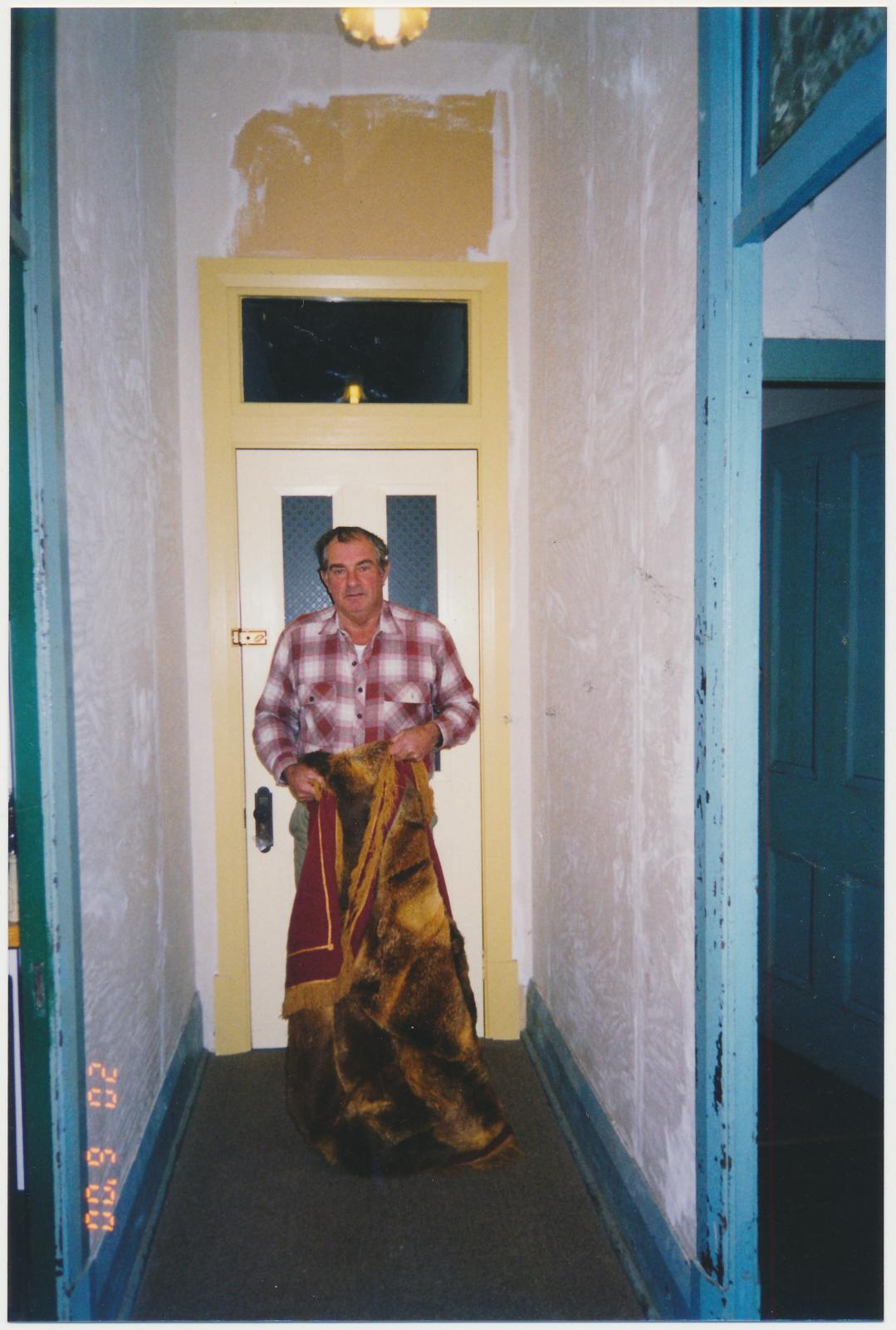 Man holding Fox Skin Rug