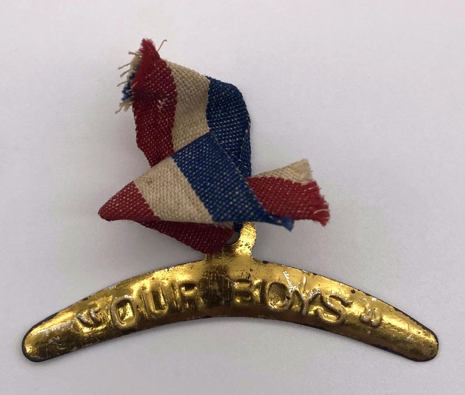 Second WWI fundraising metal boomerang on a tricolour ribbon supporting 'Our Boys'
