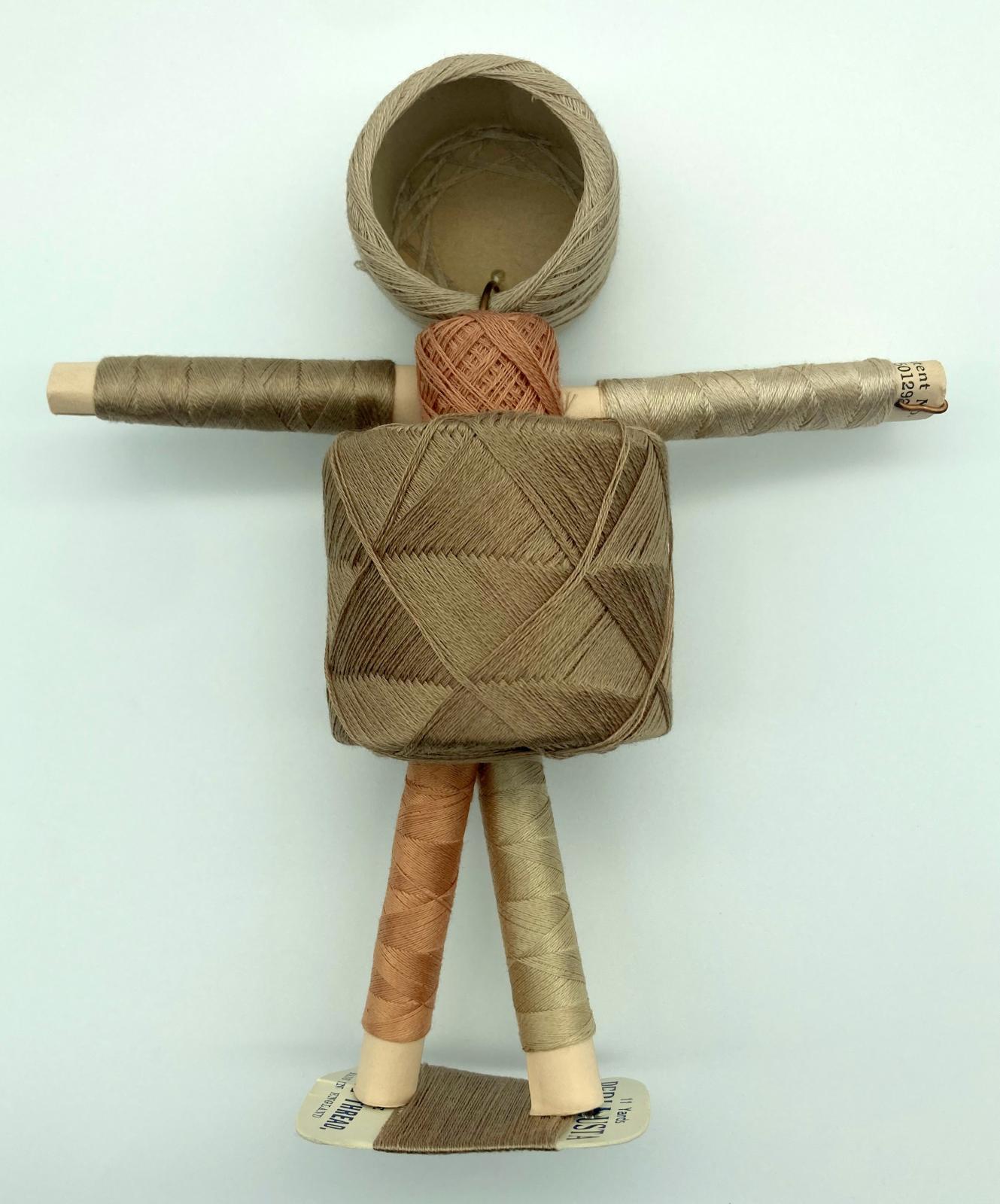 Reverse of WWII 'Make Do and Mend' pantyhose repair kit in form of doll