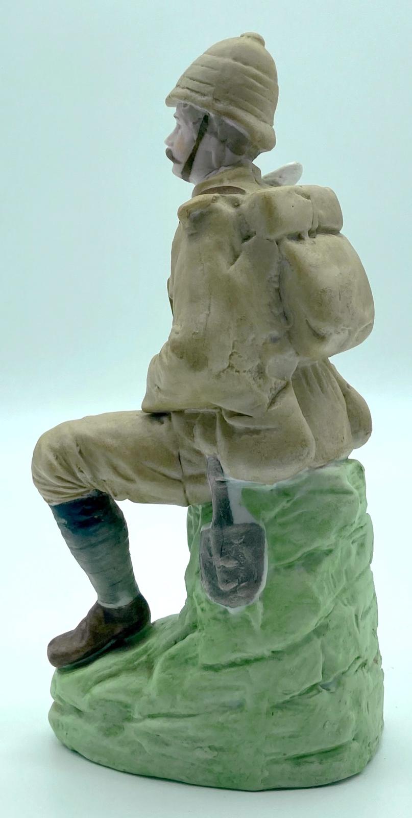 Bisque figurine of a wounded Boer War soldier - side view
