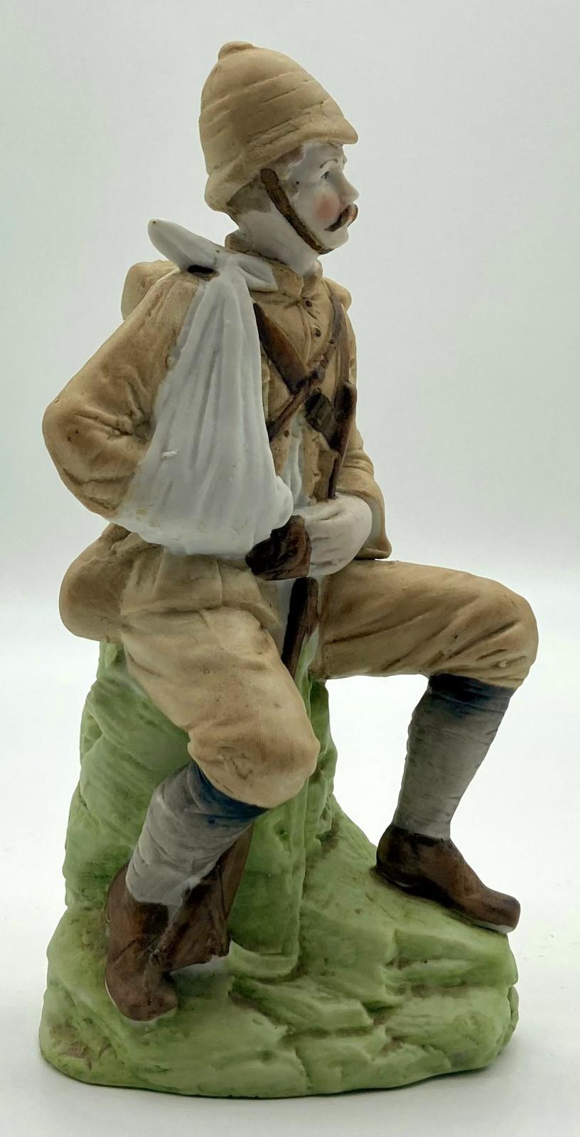 Bisque figurine of a wounded Boer War soldier - other side view