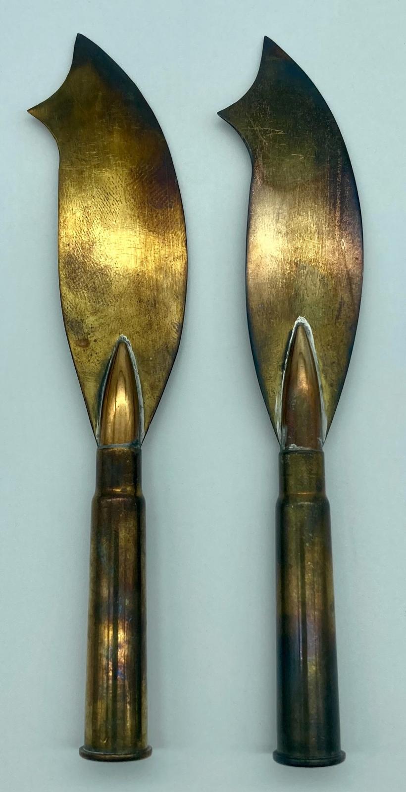 Close-up of two knives from trench art cutlery set