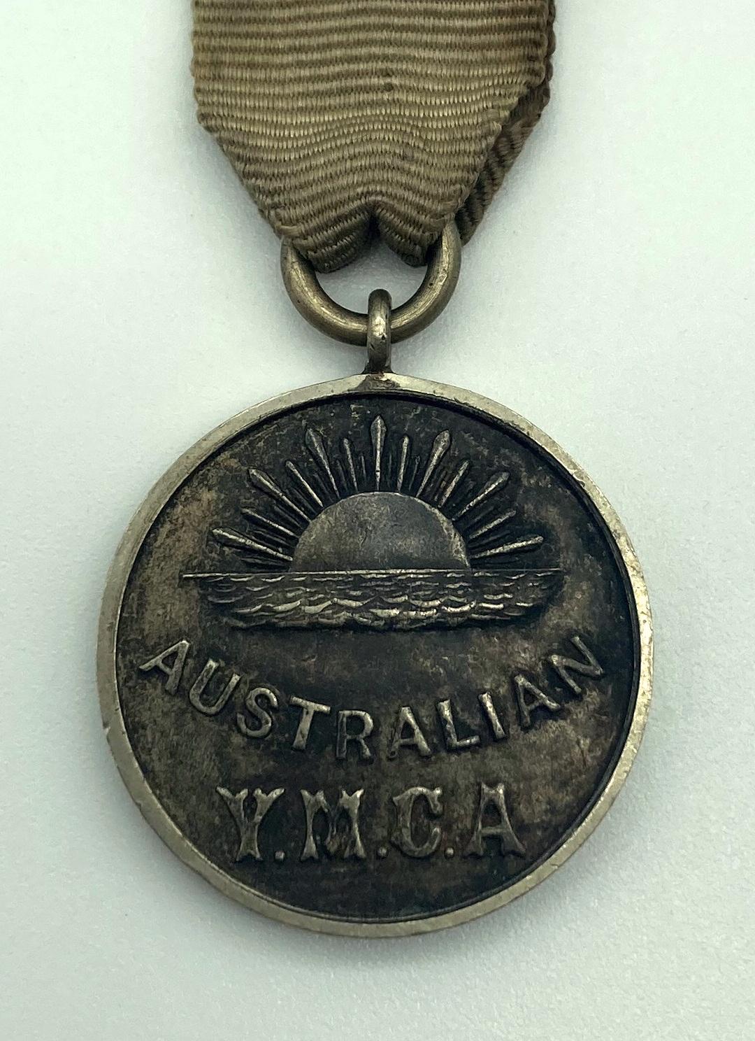 Close up of Australian Y.M.C.A. Service medal awarded to volunteers at Aldwych Theatre, London