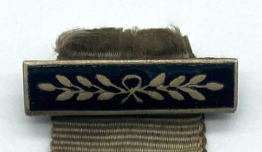 Close-up of enamel suspension bar of Y.M.C.A. service medal