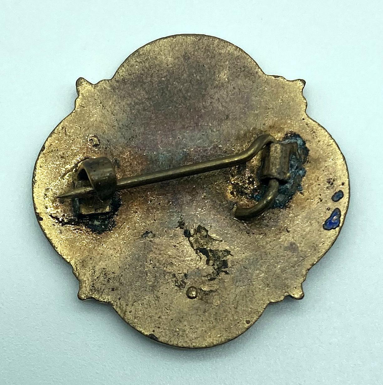 Reverse of WWII Y.M.C.A. Scottish Branch Voluntary War Service badge