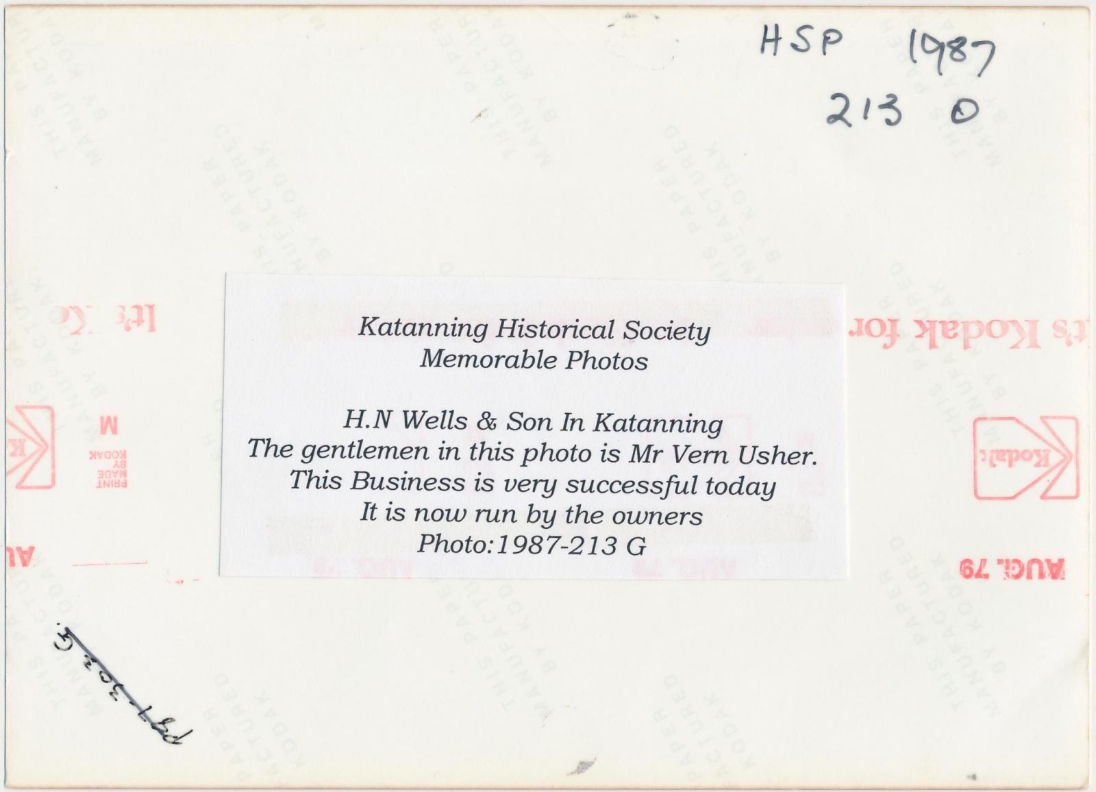 Back of photograph of H.N. Wells & Son Menswear and Tailors