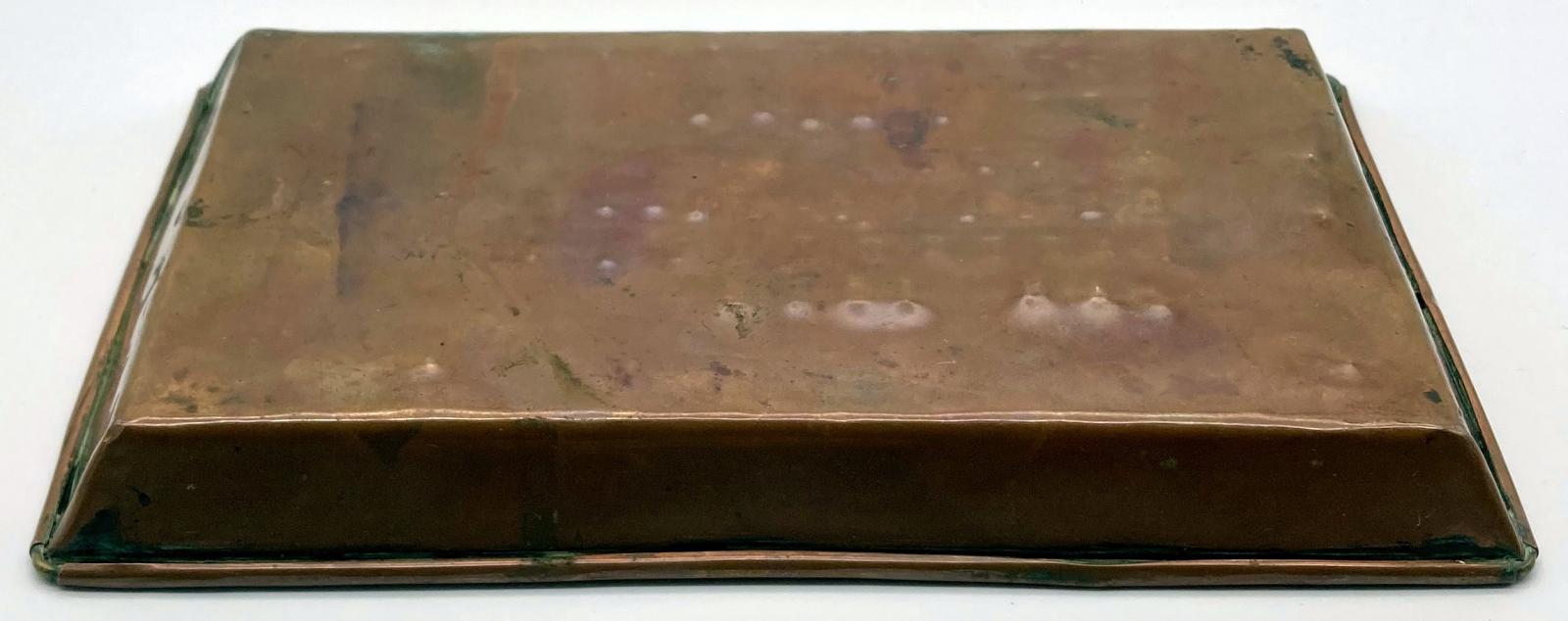 Angled view of base of copper tray