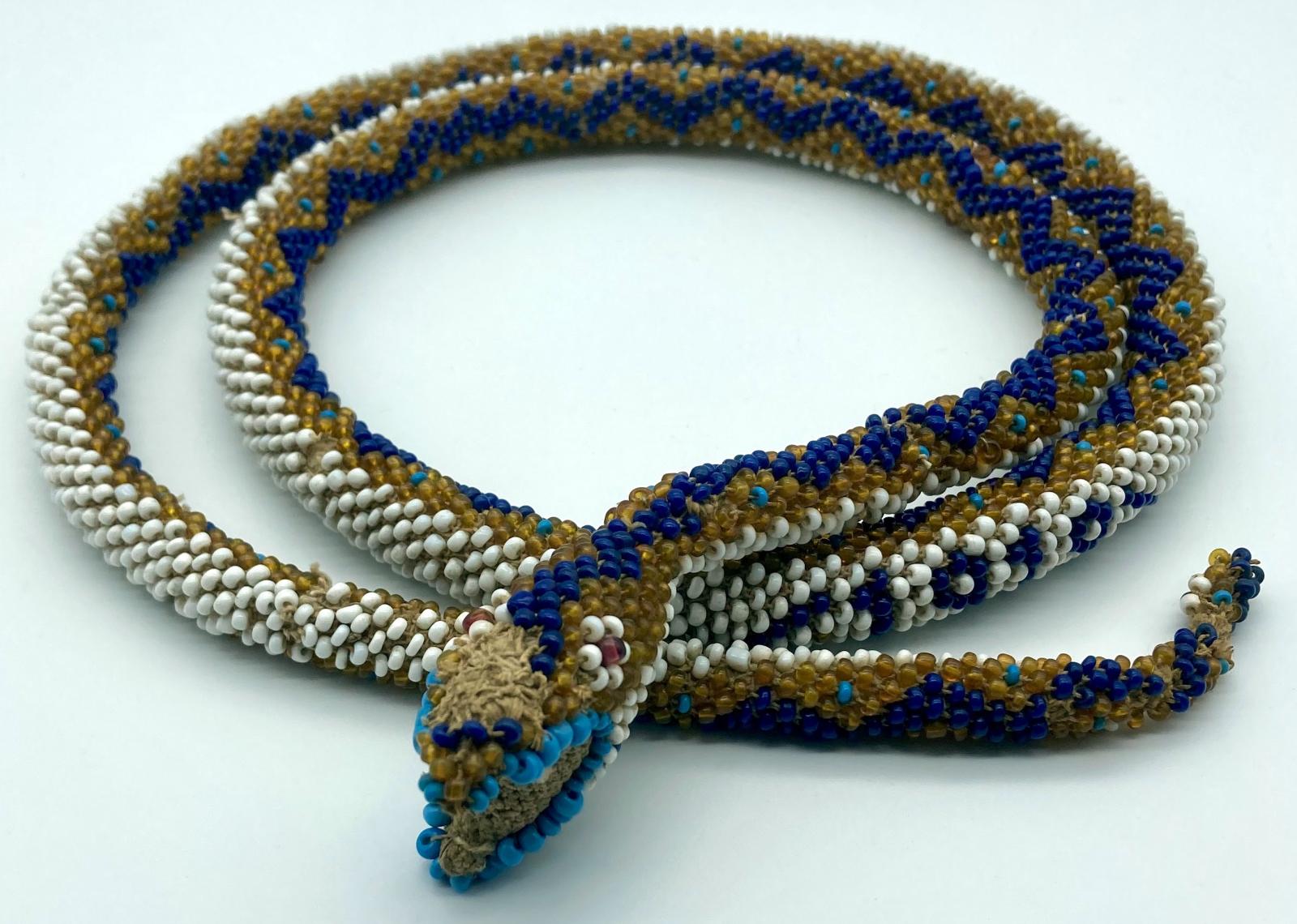 Ottoman prisoner of war beadwork snake, showing head and date