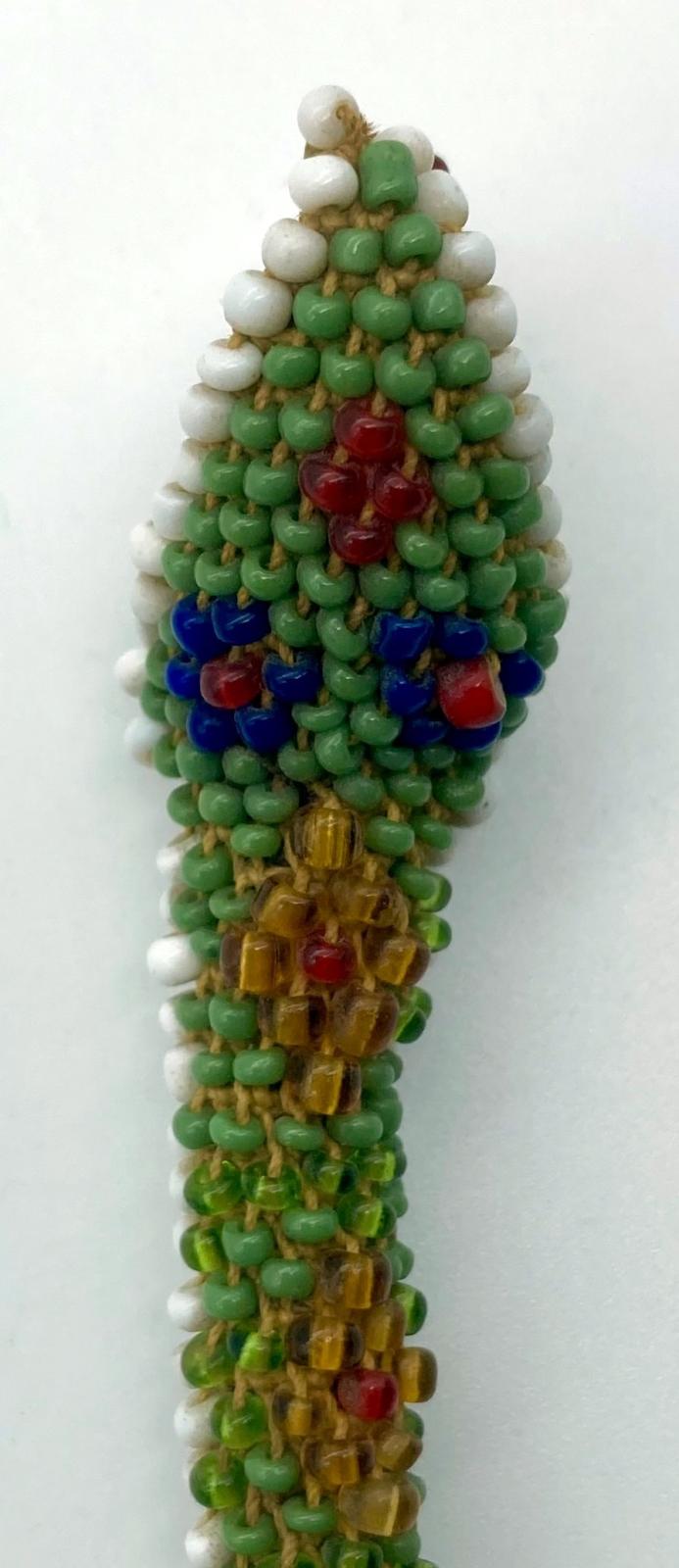 Top view of head of the head of the small Ottoman prisoner of war beadwork snake